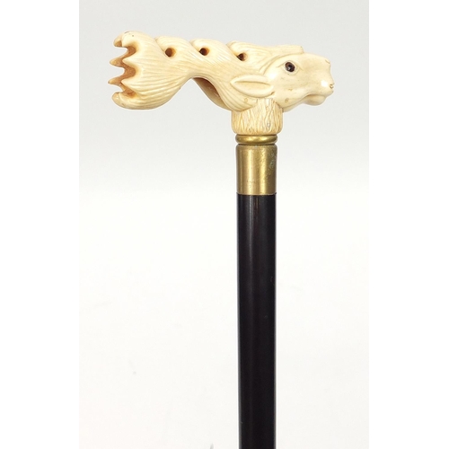 1131 - Hardwood walking stick with carved bone stag design handle, 91.5cm in length