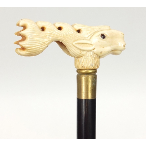 1131 - Hardwood walking stick with carved bone stag design handle, 91.5cm in length