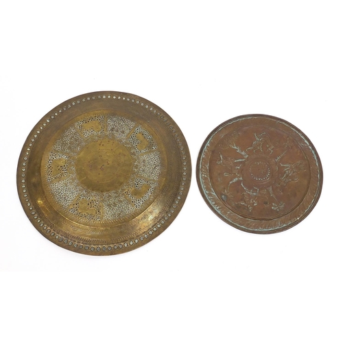 470 - Two good Indian brass trays including one finely embossed with huntsmen and wild animals, the larges... 