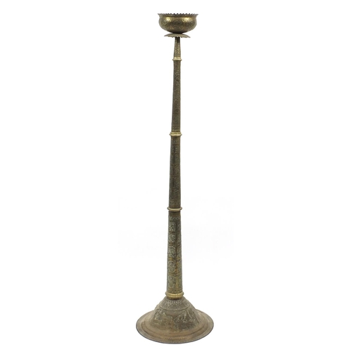 65 - Islamic floor standing incense burner/lamp profusely embossed with deities, 182cm high