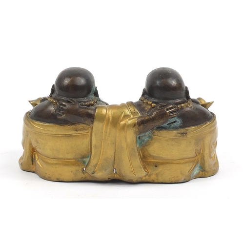 668 - Chinese partially gilt bronze group of two Buddhas, 16cm wide