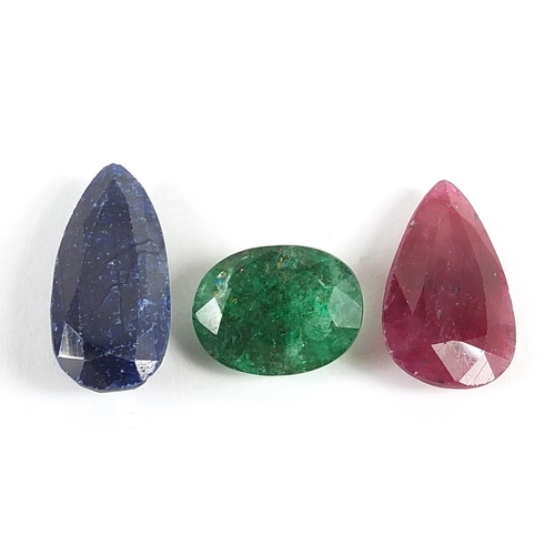 83 - Three gemstones with certificates comprising ruby, approximately 15.5 carat, oval beryl emerald, app... 