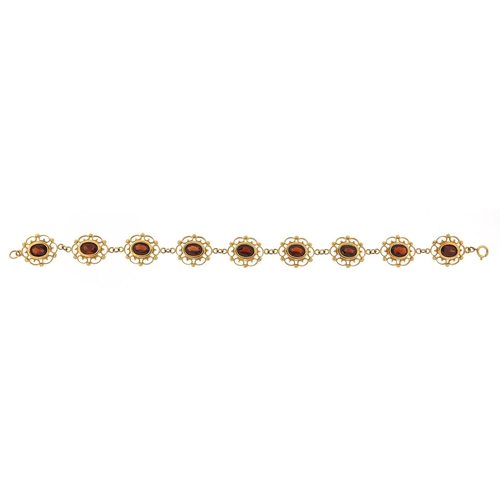 211 - 9ct gold garnet bracelet, 18cm in length, 8.2g