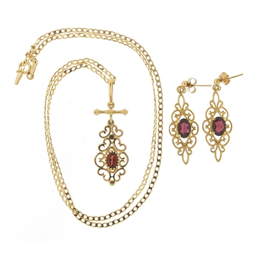 314 - 9ct gold garnet pendant on a 9ct gold necklace and matching earrings, the earrings 3.2cm high, total... 