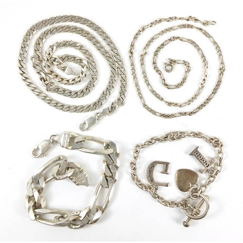 784 - Silver jewellery comprising a heavy Figaro link bracelet, two necklaces and a charm bracelet, 84.5g