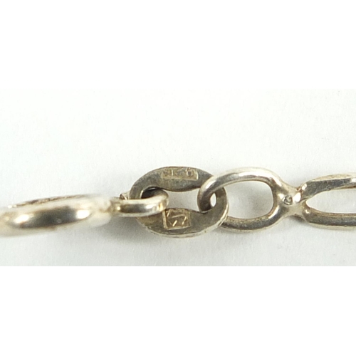 784 - Silver jewellery comprising a heavy Figaro link bracelet, two necklaces and a charm bracelet, 84.5g