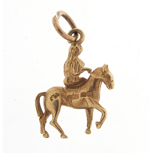 263 - 9ct gold nude female on horseback, possibly Lady Godiva, 1.6cm high, 1.6g