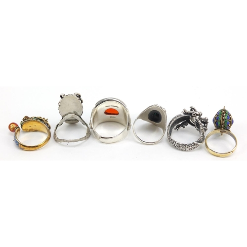 501 - Six Chinese silver rings, some with enamel including dragons, various sizes, 49.6g