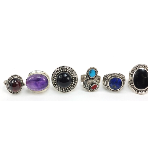 268 - Twelve silver rings set with semi precious stones including turquoise, amethyst, lapis lazuli and on... 