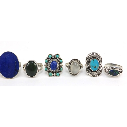 268 - Twelve silver rings set with semi precious stones including turquoise, amethyst, lapis lazuli and on... 