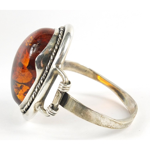 550 - Large silver and natural amber bangle, 61.3g