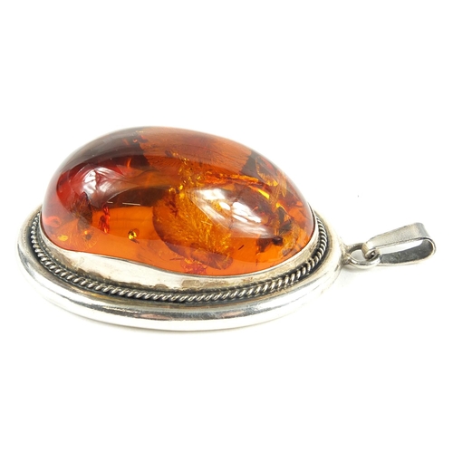 216 - Large silver and natural amber pendant, 7.5cm high, 46.8g