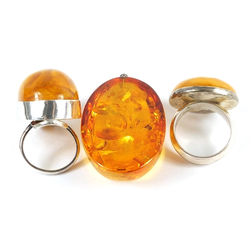 381 - Silver and natural amber ring, pendant and silver and butterscotch coloured amber coloured ring, the... 