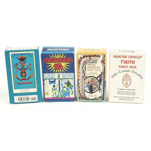 1027 - Four vintage fortune telling tarot card decks comprising Thothyalerster Crowley, Cartomanzia 184, Th... 