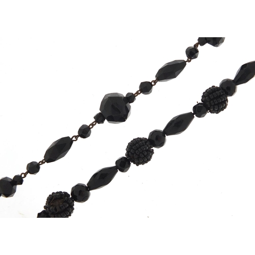 1041 - Victorian Whitby jet necklace and bracelet, the necklace 130cm in length, total 84.0g