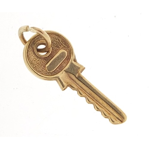 687 - Unmarked gold key charm, 2cm high, 0.6g