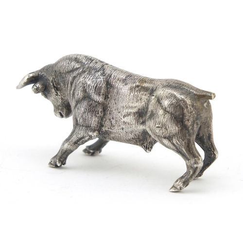 767 - Heavy cast silver model of a bull, 6.5cm in length, 143.4g