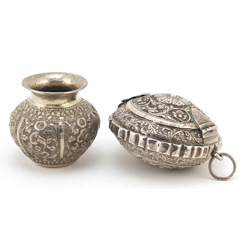 619 - Burmese silver coloured metal Betel box with hinged lid and vase, the largest 8.5cm in diameter, tot... 