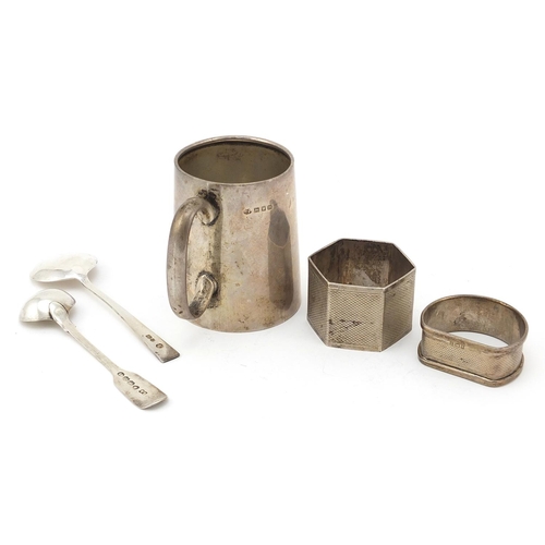 841 - Silver items comprising christening tankard, Georgian silver mustard spoon, two napkin rings and one... 