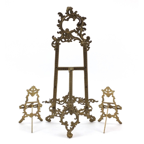 588 - Three Rococo style brass easel stands, the largest 53.5cm high