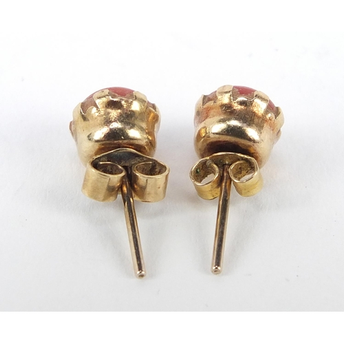 869 - Pair of 9ct gold coral stud earrings, 6.5mm diameter, 1.2g