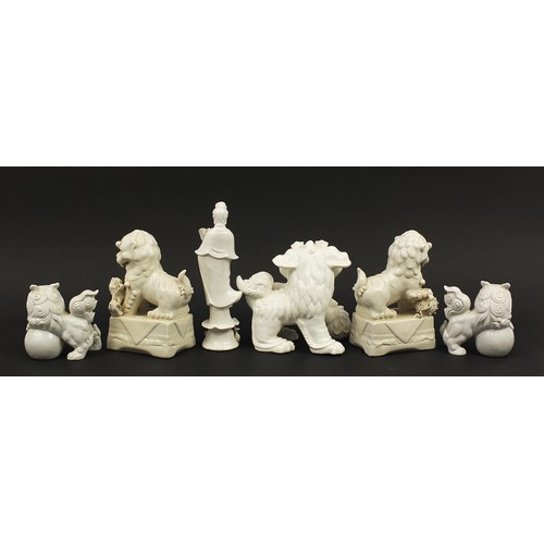 970 - Chinese blanc de chine porcelain comprising five Foo dogs and a figure of Guan Yin, the largest 28cm... 