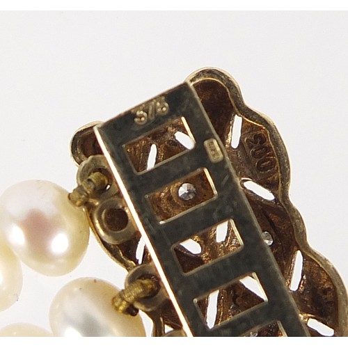 275 - Three row pearl bracelet with 9ct gold and diamond clasp, 18cm in length, 22.2g