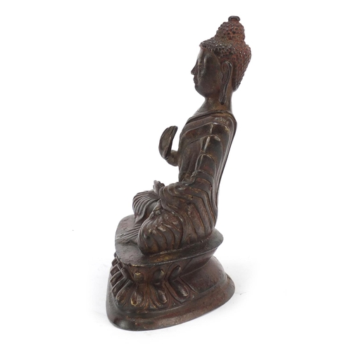 924 - Chino-Tibetan patinated bronze figure of Buddha, 16cm high