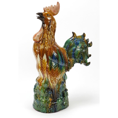914 - Large Chinese porcelain cockerel having a sancai type glaze, 58.5cm high