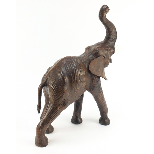 1129 - * WITHDRAWN* Vintage leather covered elephant, possibly retailed by Liberty & Co, 42cm high