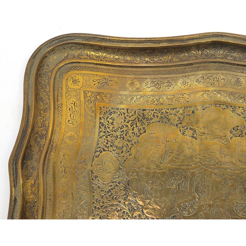 62 - Good Islamic brass tray finely engraved with figures amongst flowers and calligraphy, 47cm x 34cm