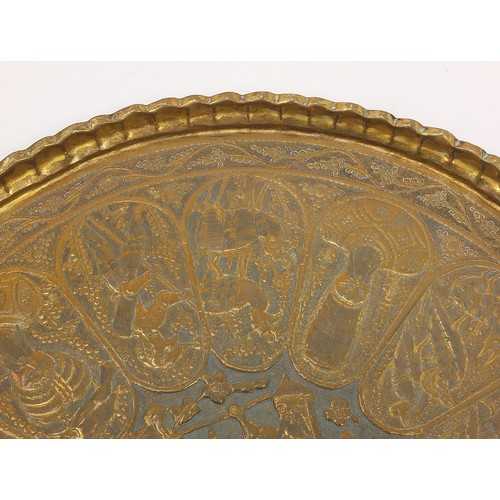 472 - Four good Indian brass trays comprising an octagonal example profusely and finely embossed with flow... 