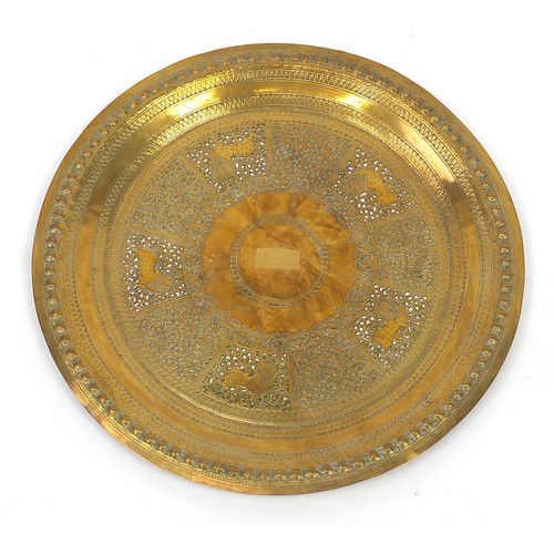 470 - Two good Indian brass trays including one finely embossed with huntsmen and wild animals, the larges... 