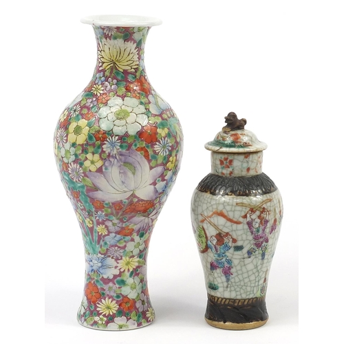 97 - Two Chinese porcelain vases including a baluster example hand painted with flowers, the largest 25cm... 