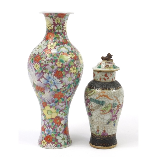 97 - Two Chinese porcelain vases including a baluster example hand painted with flowers, the largest 25cm... 