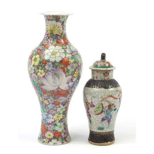 97 - Two Chinese porcelain vases including a baluster example hand painted with flowers, the largest 25cm... 