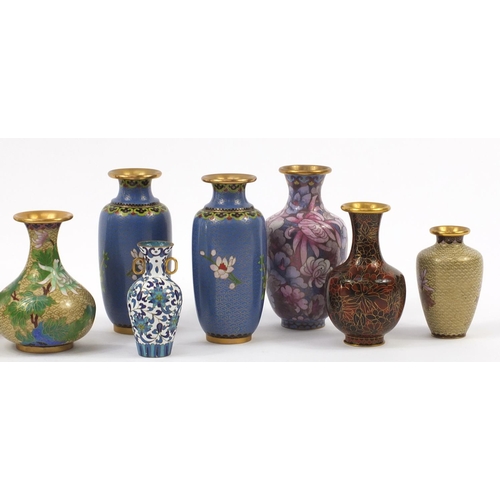 357 - Twelve Chinese cloisonné vases, each enamelled with flowers including two pairs within ruyi head bor... 