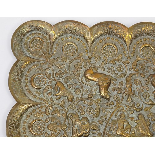 469 - Two good Indian brass trays comprising one finely embossed with two figures and wild animals amongst... 