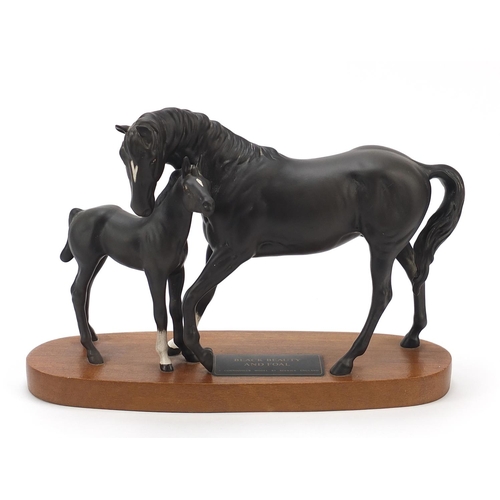 1334 - Beswick Connoisseur model titled Black Beauty and Fowl raised on an oval wood base, 29.5cm wide
