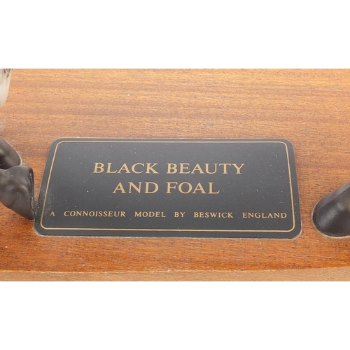1334 - Beswick Connoisseur model titled Black Beauty and Fowl raised on an oval wood base, 29.5cm wide