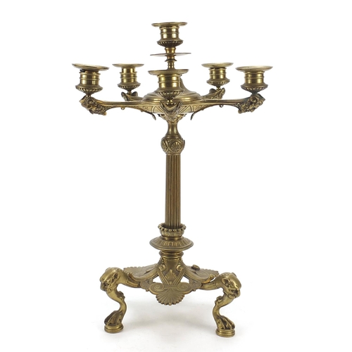 37 - 19th century gilt bronze six branch candelabra with grotesque mask heads and paw feet, 45cm high