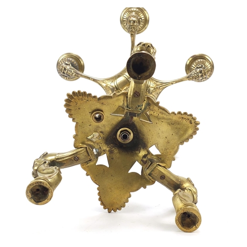 37 - 19th century gilt bronze six branch candelabra with grotesque mask heads and paw feet, 45cm high