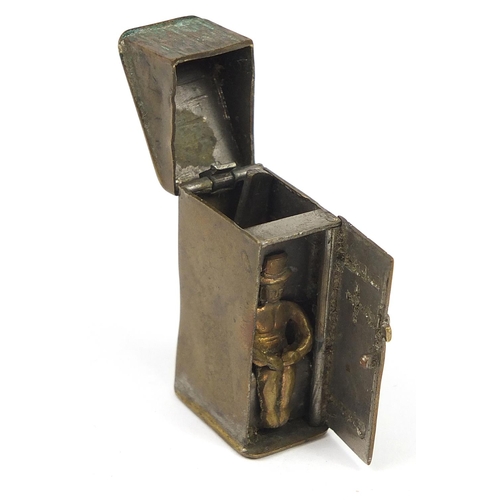 45 - Antique brass vesta in the form of a man in a outhouse privy toilet, 5cm high