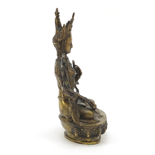 16 - Chino Tibetan patinated bronze figure of seated Buddha set with jewels including rubies and sapphire... 