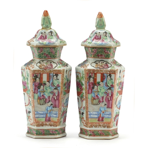 58 - Good pair of Chinese Canton porcelain hexagonal vases and covers with figural knops, each hand paint... 