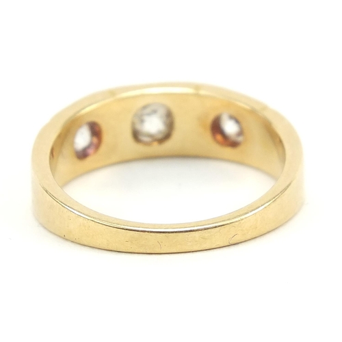 51 - 18ct gold diamond three stone Gypsy ring, housed in a M L Millward box, size L/M, 4.8g