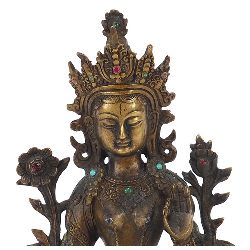 16 - Chino Tibetan patinated bronze figure of seated Buddha set with jewels including rubies and sapphire... 