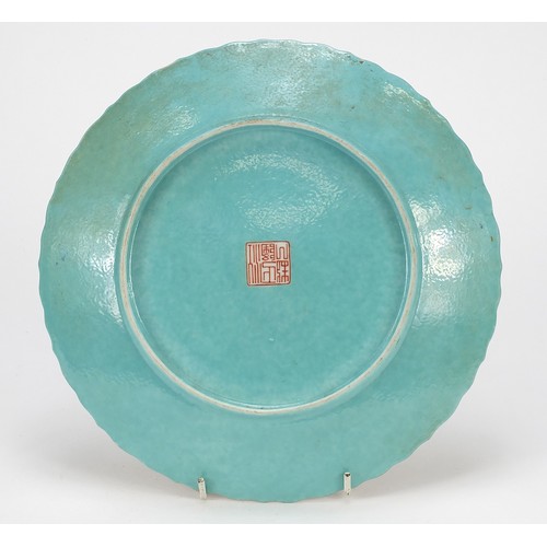 10 - Chinese porcelain plate finely hand painted in the famille rose palette with figures in a palace wit... 