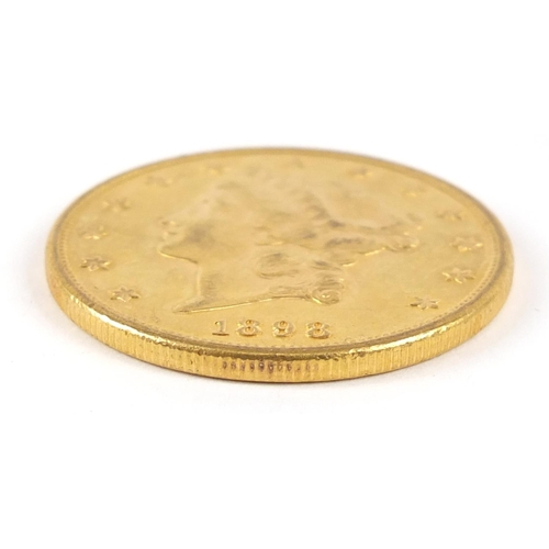 550 - United States of America 1898 gold twenty dollars, Liberty head to the reverse, 33.6g - this lot is ... 