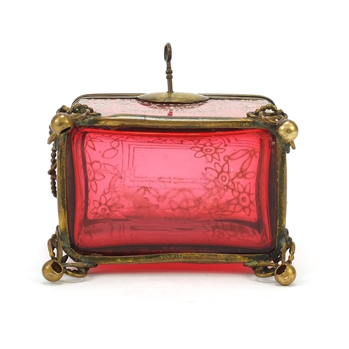 298 - 19th century cranberry glass dome top casket with bronzed mounts, 12cm H x 10cm H x 7cm D